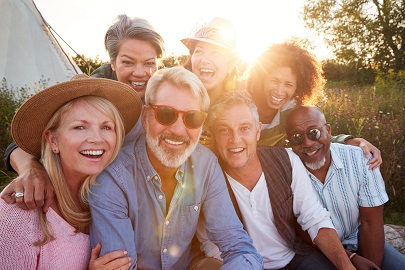 Friends Smiling with sun behind them